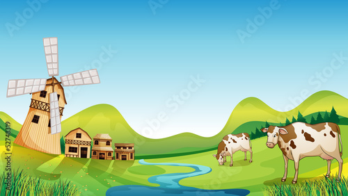 A farm with a barn and cows