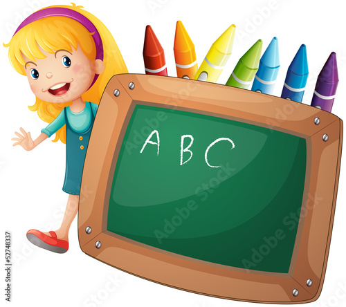 A young girl beside a blackboard and crayons
