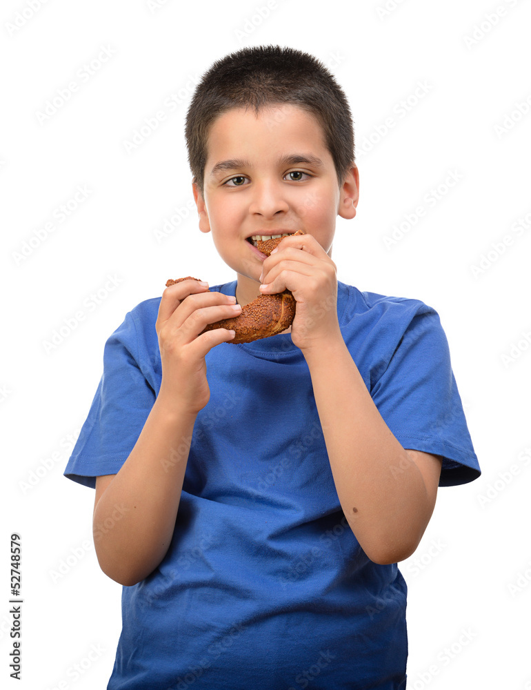 Child eating traditional Turkish donut, called Simit Child eating traditional Turkish donut, called Simit