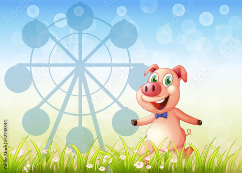 A pig near the ferris wheel at the hill