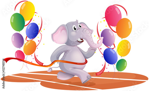 An elephant running with balloons
