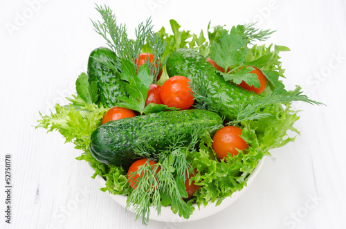 bowl with fresh vegetables and herbs for salad horizontal