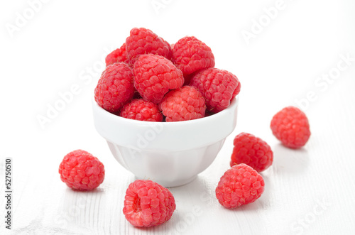 fresh raspberries in a white bowl