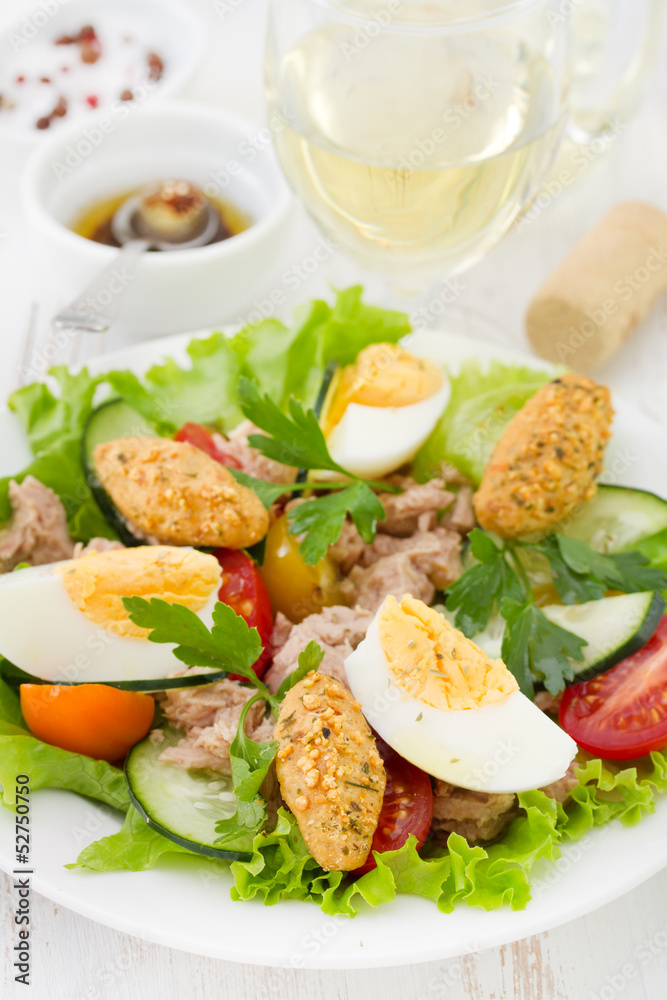 salad with fish and egg on the plate salad with fish and egg on the plate