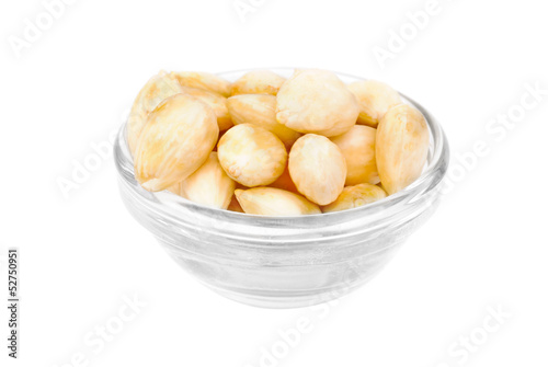 Dried  peeled almonds on glass bowl