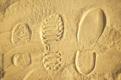 Family human footprints in the sand