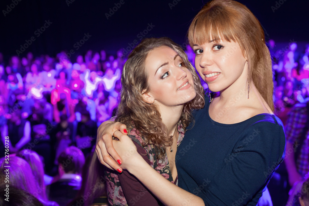 Two beautiful girls in a party posing for the camera