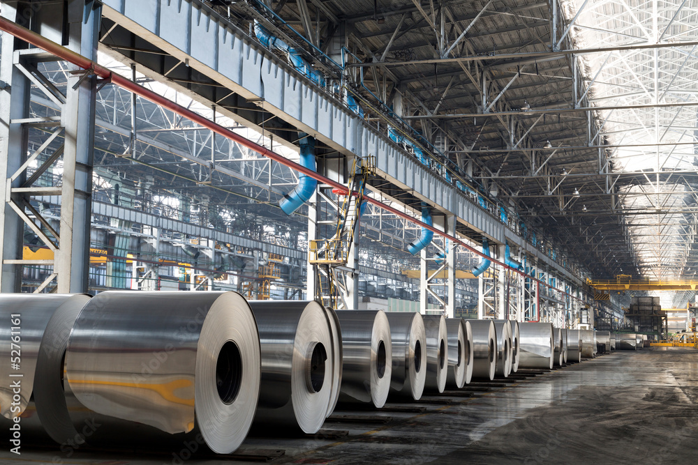 Long row of rolls of aluminum in production shop of plant. - obrazy, fototapety, plakaty 