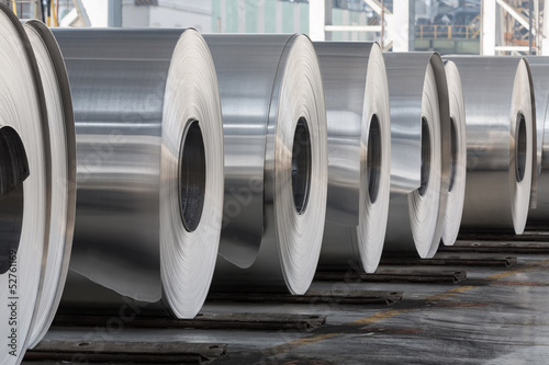 Rolls of aluminum close up in production shop of plant.