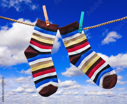 colorful socks hanging on clothespins