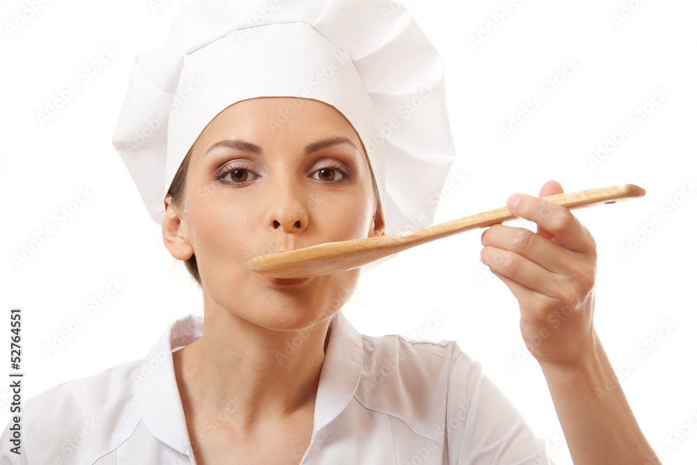 Woman cook eating with spoon, isolated on white background Woman cook eating with spoon, isolated on white background
