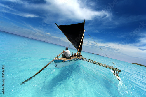 Canvastavla sailing in a tropical lagoon