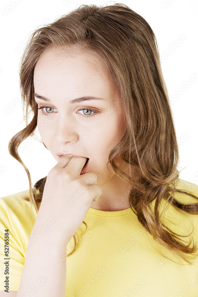 Woman putting her finger in her mouth