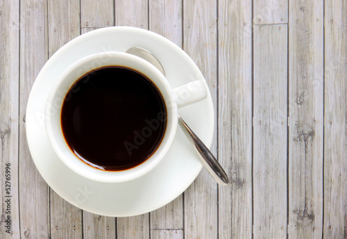 Black coffee in white cup with spoon