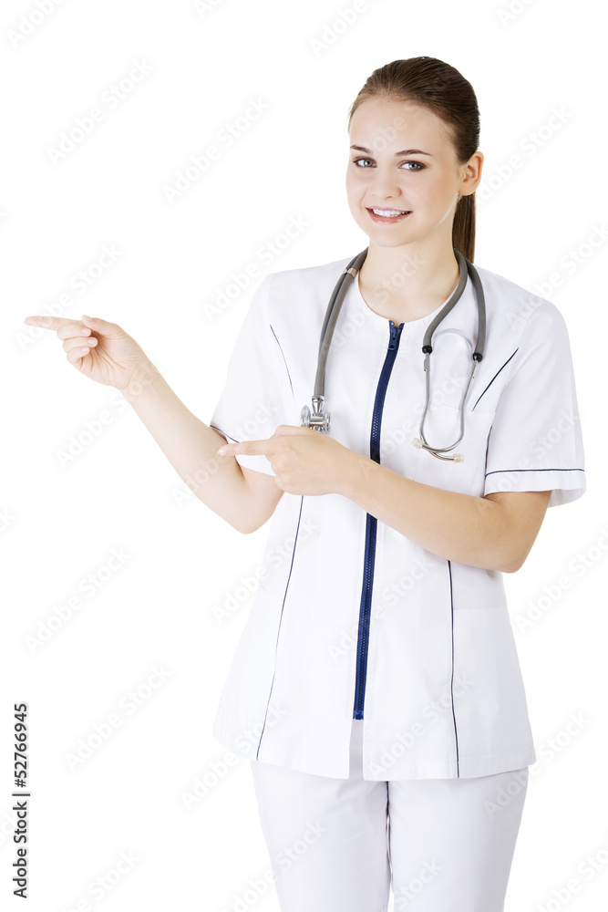Medical doctor woman presenting and showing copy space Medical doctor woman presenting and showing copy space