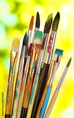 Many brush in paint on nature background