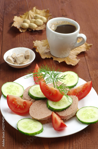 Sandwich with liver sausage and cup coffee
