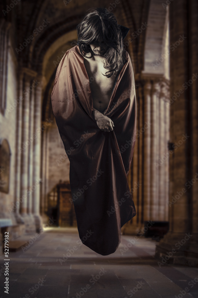 magician levitating inside a Gothic cathedral