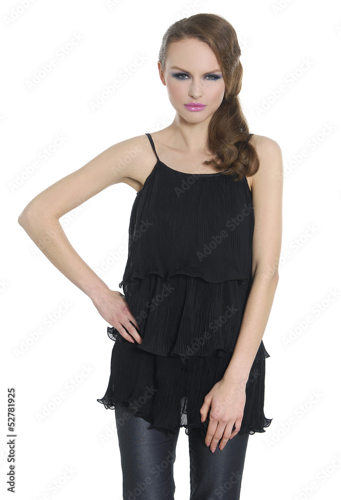 Beautiful casual young woman in jeans standing posing Beautiful casual young woman in jeans standing posing