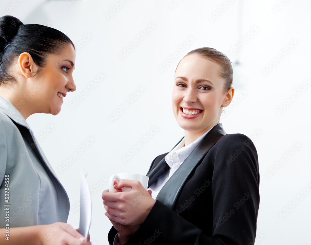 Two attractive business women smiling Two attractive business women smiling