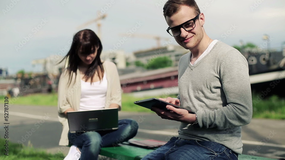 Happy student with tablet computer in the city Happy student with tablet computer in the city