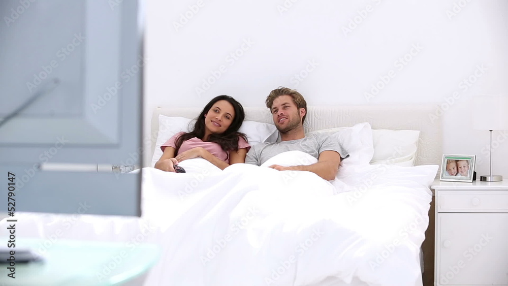 Couple watching television together