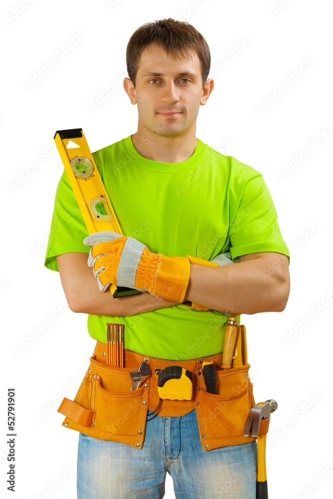 aworker with toolbelt and construction level aworker with toolbelt and construction level