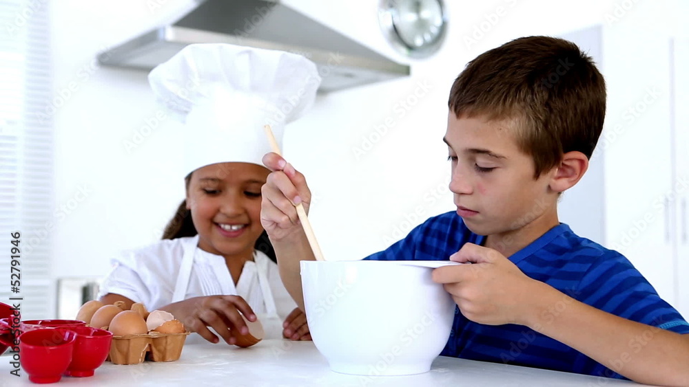 Siblings preparing pastry together Siblings preparing pastry together