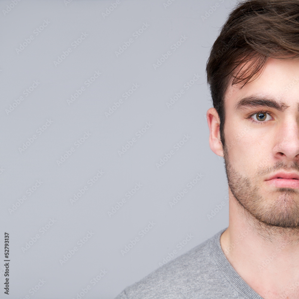 Fototapeta premium Half face portrait of a handsome young man
