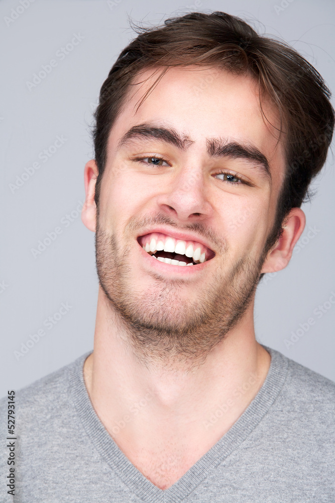 Portrait of a happy young man smiling Portrait of a happy young man smiling