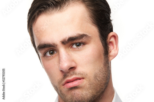 Portrait of a handsome young man isolated on white