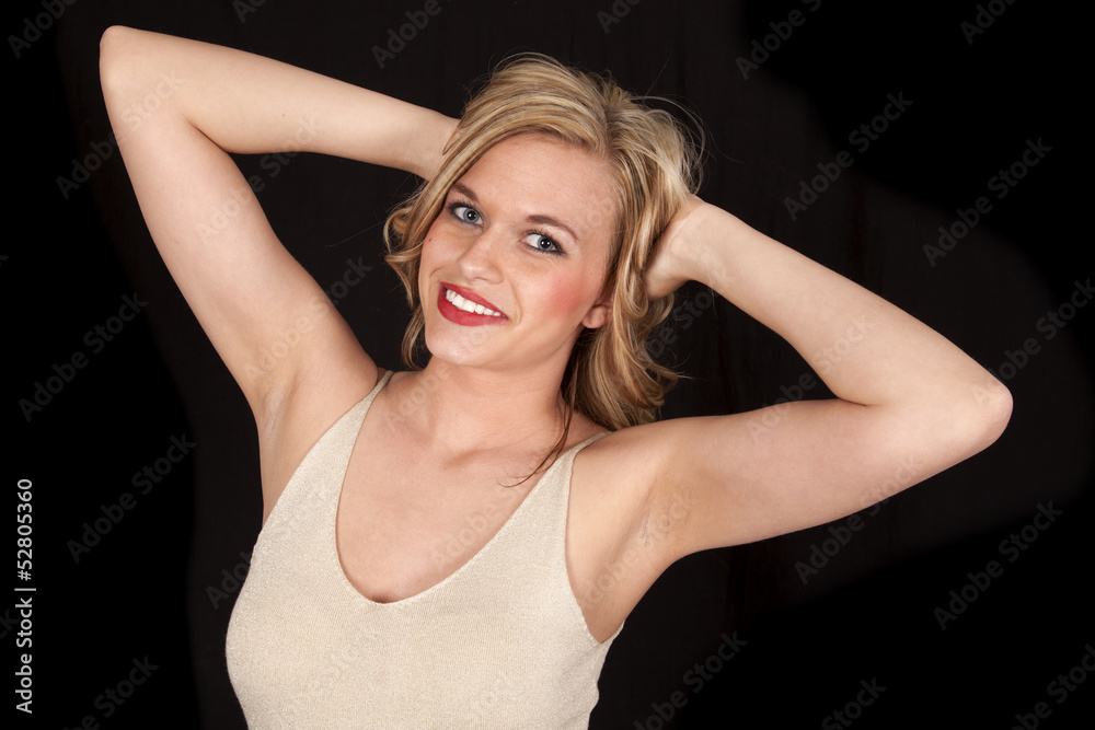 woman hands in hair on black smile woman hands in hair on black smile