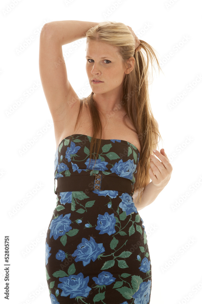 woman with flower dress hand on head