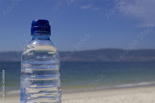 Bottle of water on the seashore
