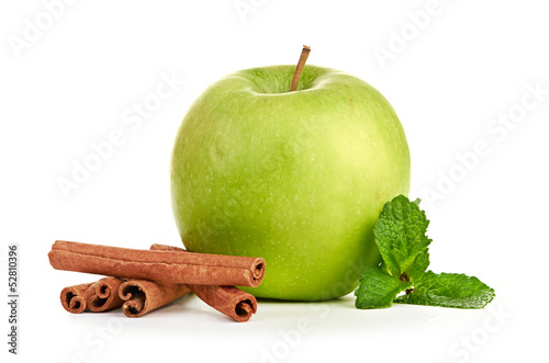 Green apple, cinnamon sticks and mint leaves