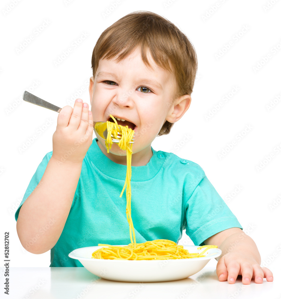Little boy is eating spaghetti Little boy is eating spaghetti