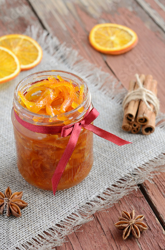 Homemade candied peels orange jam in glass jar