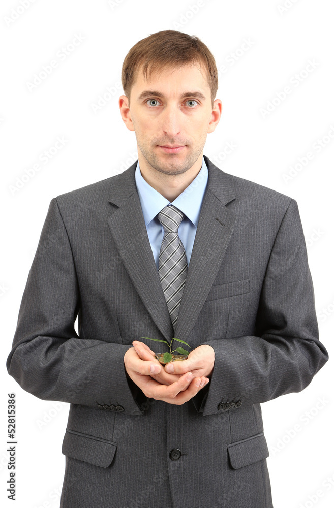 Young businessman with coins and plant isolated on white. Young businessman with coins and plant isolated on white.