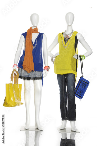 female clothes with bag and scarf on two mannequin