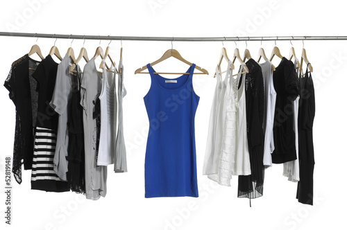 fashion female clothing hanging on hangers