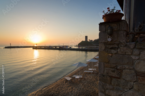 Sunrise at the beach near small fishing harbour