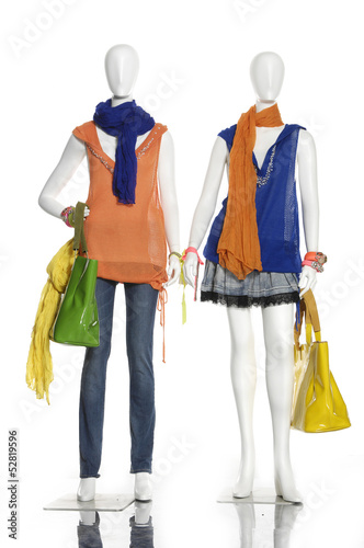 Two female clothing in jeans with bag ,scarf on mannequin