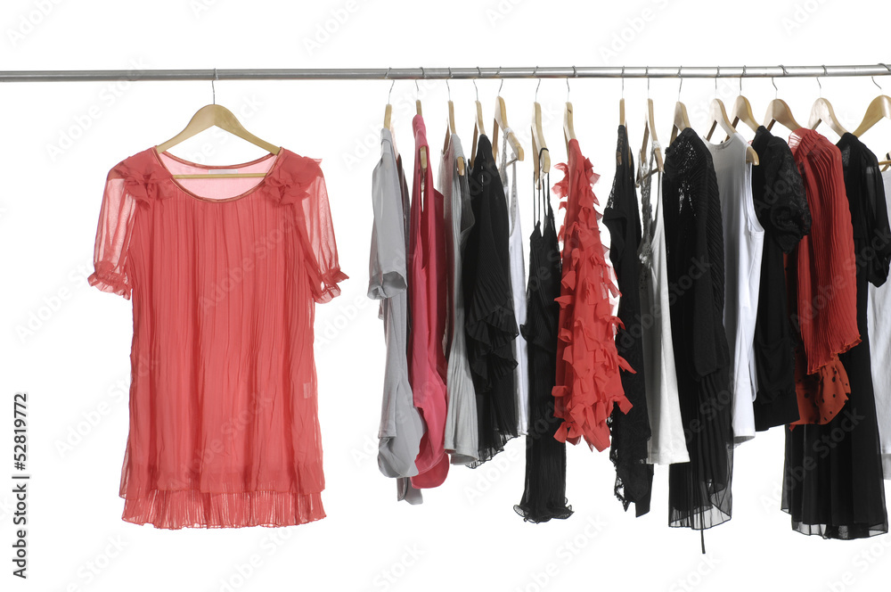 Set of fashion female clothing hanging on hangers Set of fashion female clothing hanging on hangers