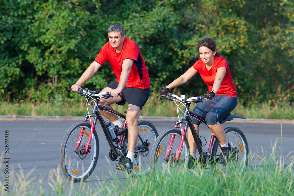 mature couple on  bicycle