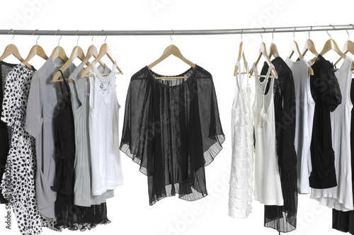 Fashion female clothing hanging on hangers © vuvu102