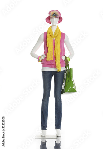 female clothing in jeans with scarf, and bag on mannequin