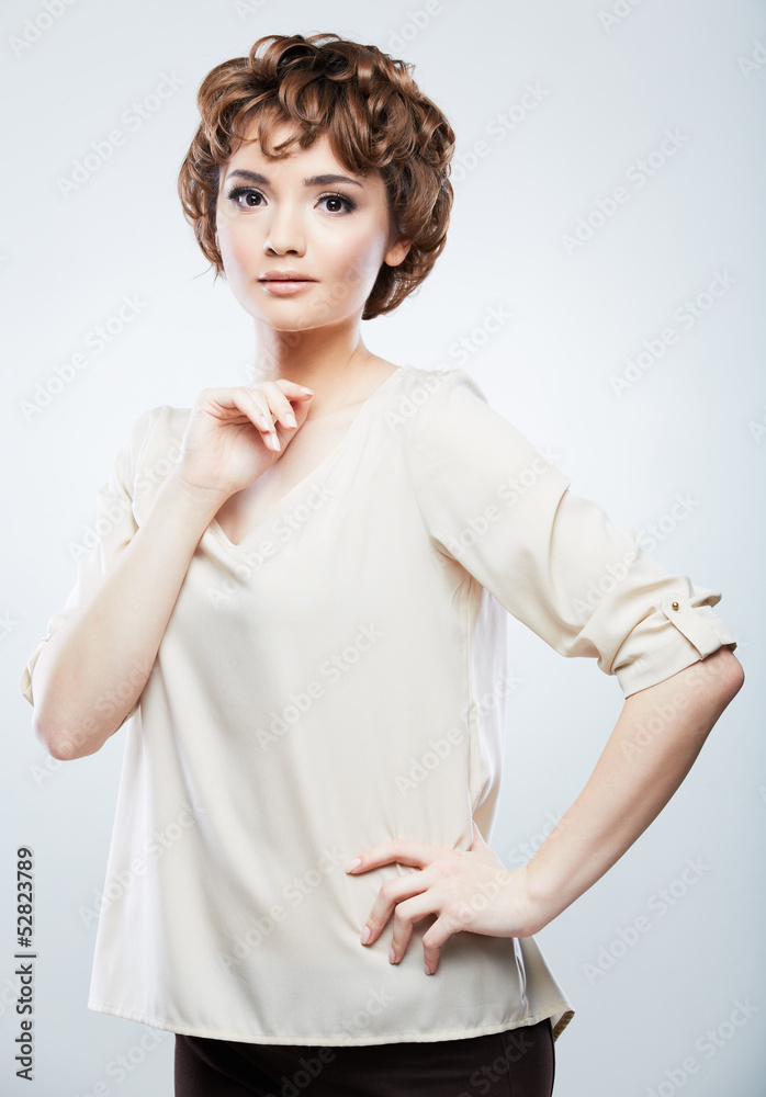 Beautiful woman standing against studio background. Beautiful woman standing against studio background.