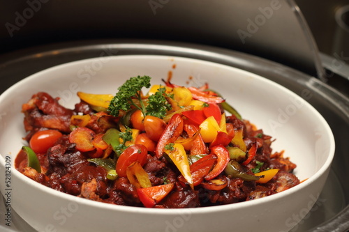 Stewed eggpland with bell pepper photo