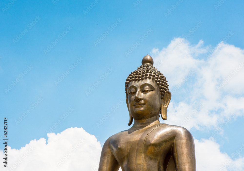 top half Buddha statue of thailand on sky