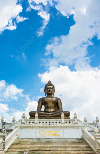 front view Buddha statue of thailand on sky